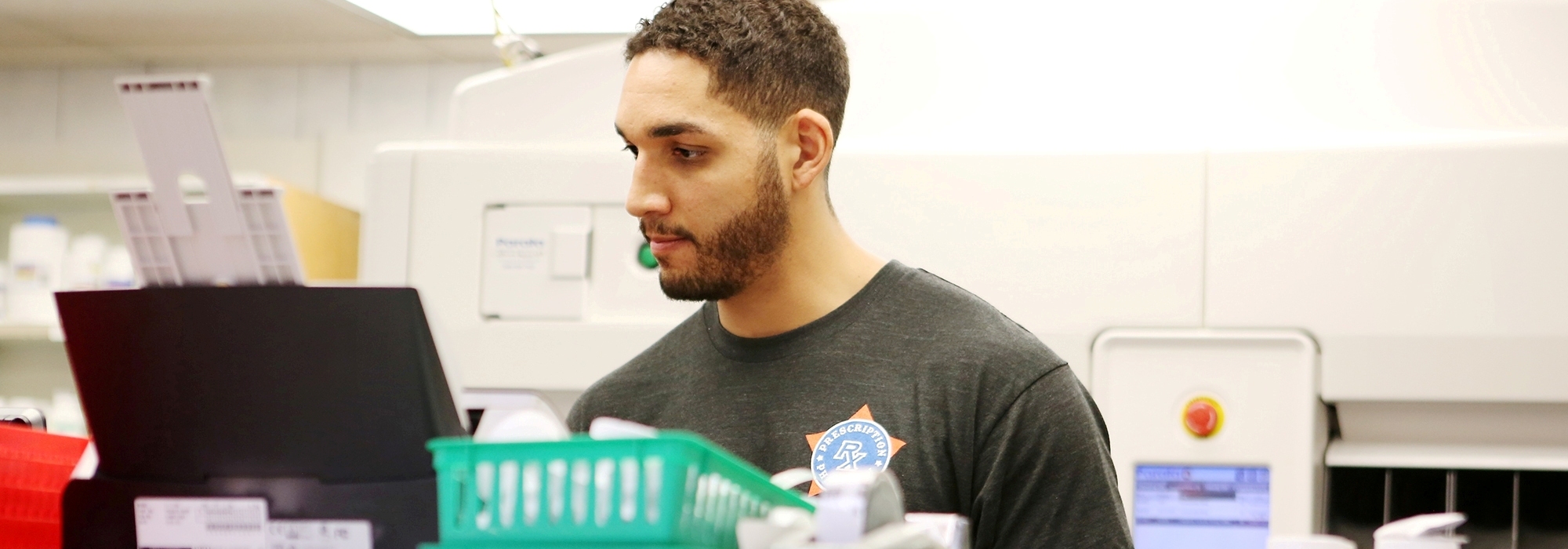 A pharmacist at work behind the counter